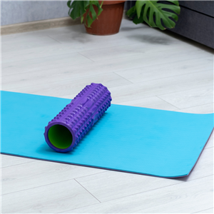 foam roller on a yoga mat